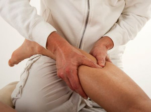 legs of a man massaged by the massager