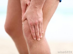 man-holding-knee